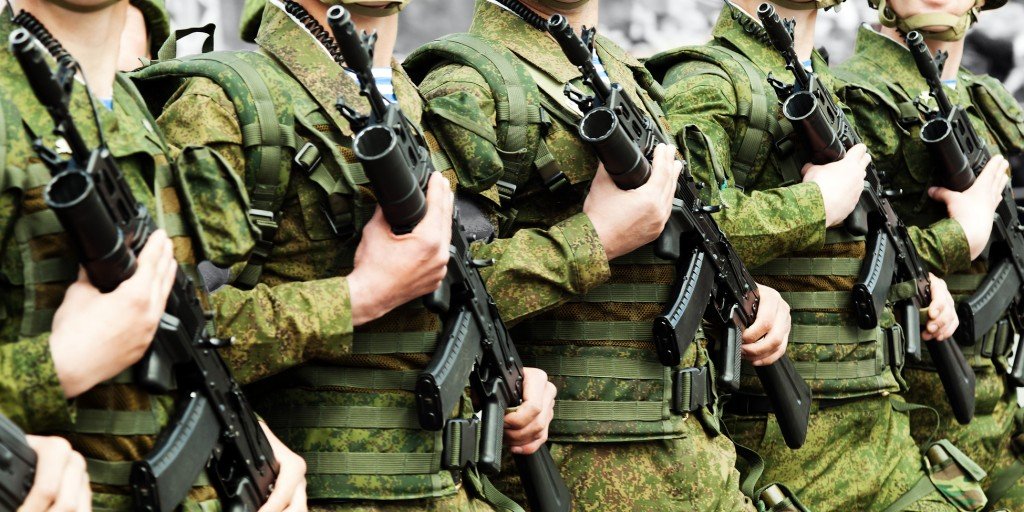 Military army holding rifile gun