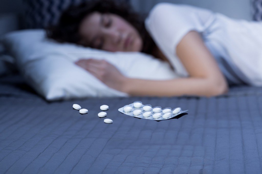 lady sleeping with sleeping pills