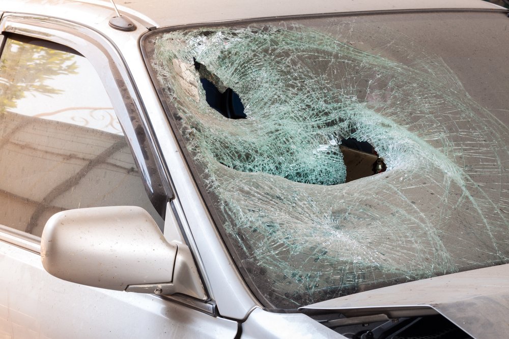Crashed car with broken windshield glass , transportation accident