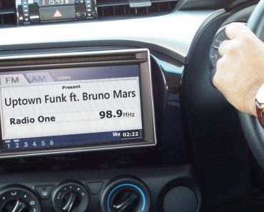 Car radio showing song name