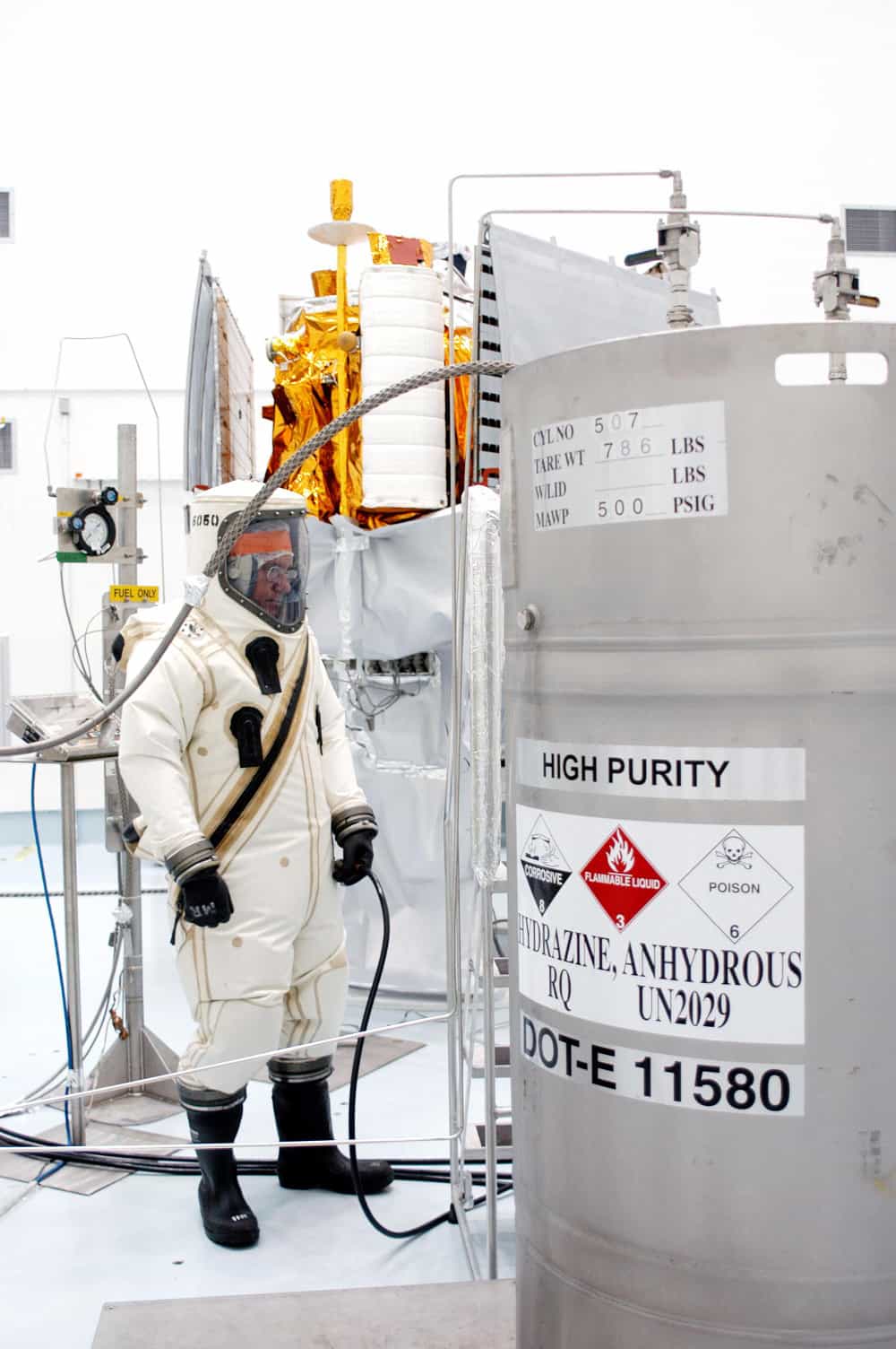 The hypergolic fuel hydrazine being loaded onto the MESSENGER space probe. Note the safety suit the technician is wearing.