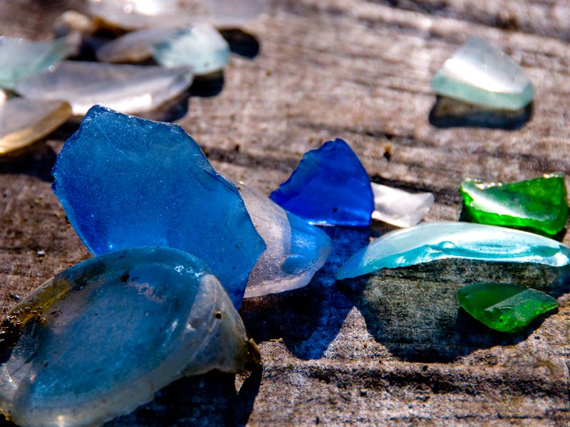 Colorful green and blue beach glass found in river in eastern PA. Note the less tumbled edges than some pieces found in the sea.