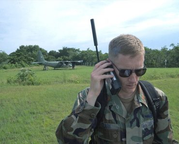 Maj. Jason Clark uses a satellite phone