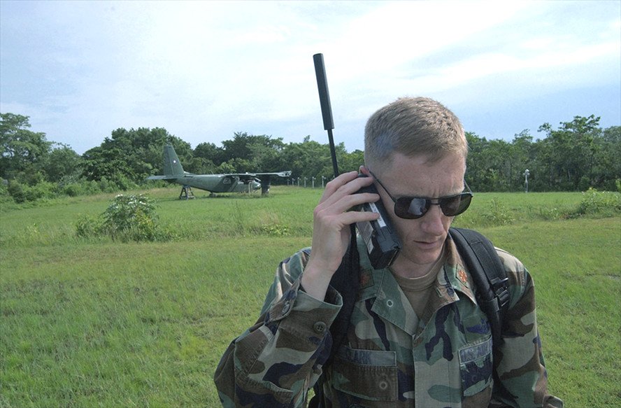 Maj. Jason Clark uses a satellite phone