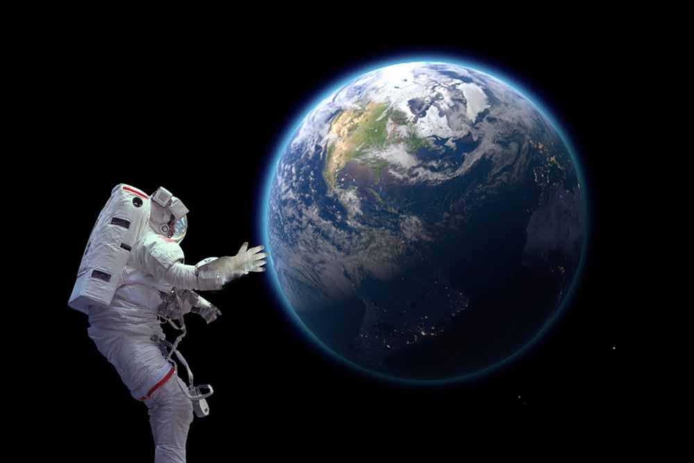 Astronaut in space looking at earth
