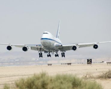 Airplane flying taking off in hot climate