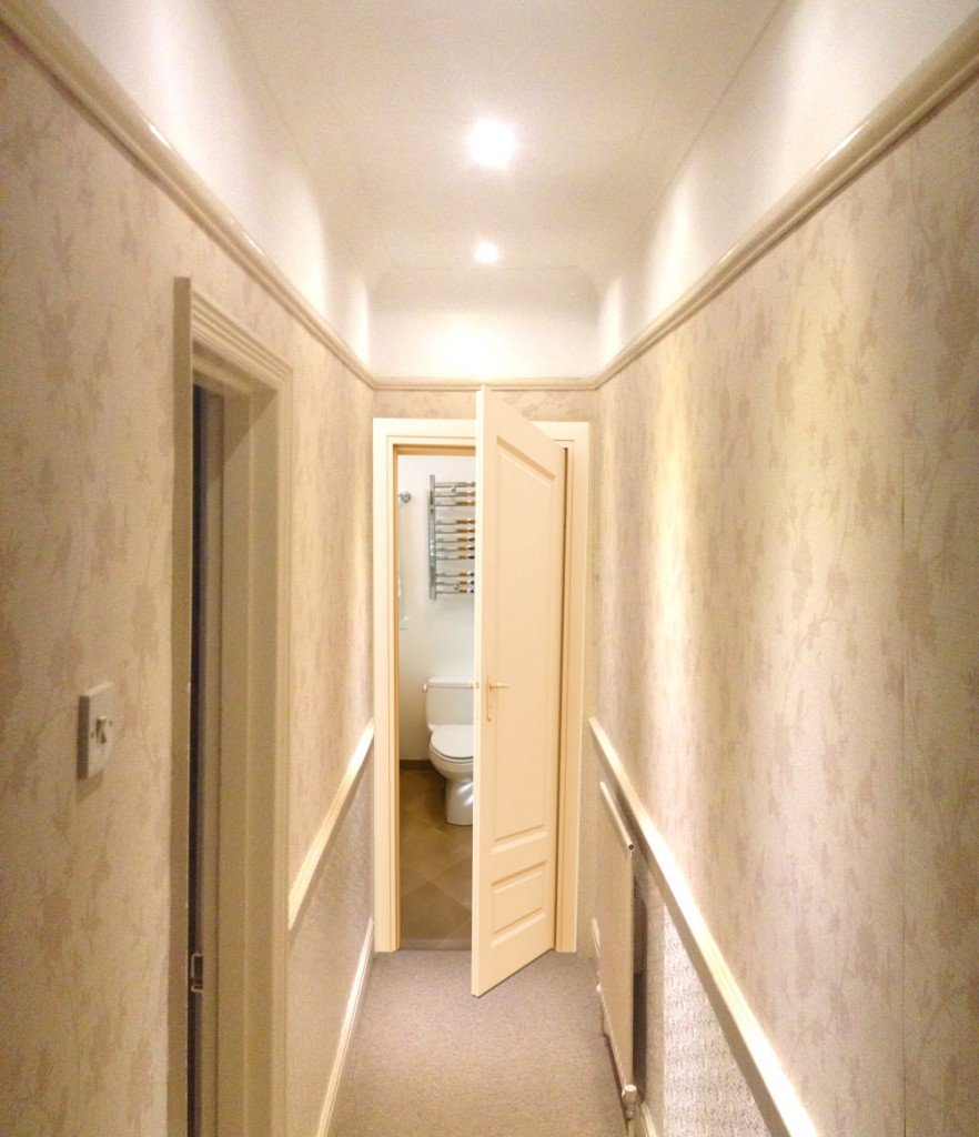 Toilet door open in hallway