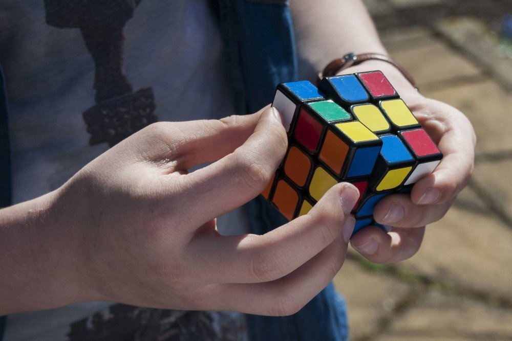 A guy trying to solve Rubik’s cube