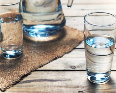 Glasses of water on a wooden table. Selective focus. Shallow DOF - Image( SedovaY)s