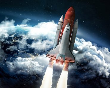 Space shuttle in the space near Earth. Clouds and sky on background. Atmosphere. Elements of this image furnished by NASA - Image(Dima Zel)s
