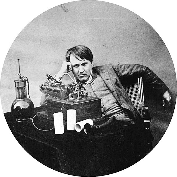 Thomas Edison with a primitive set of headphones