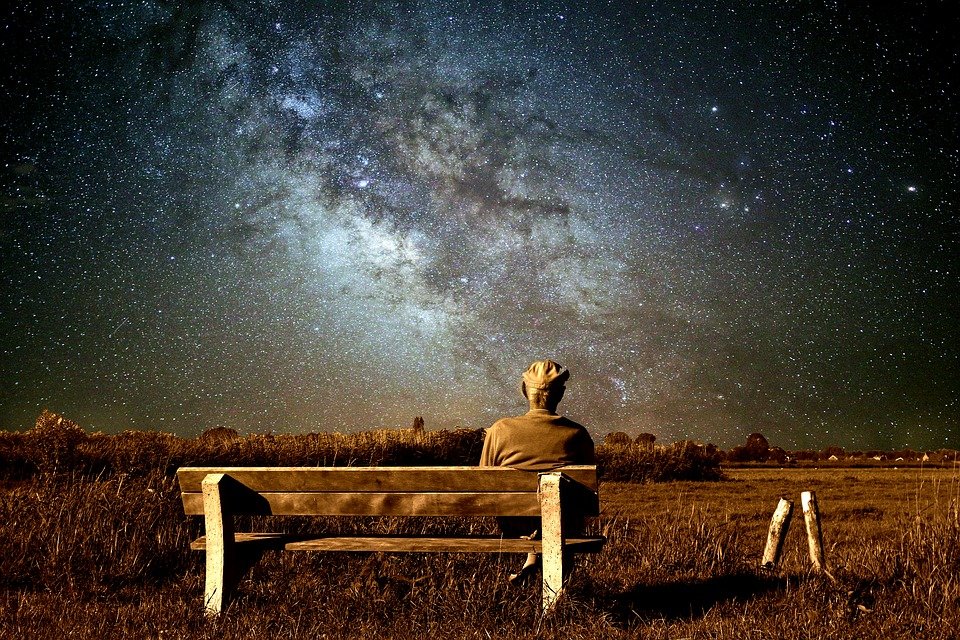 old man sitting alone universe