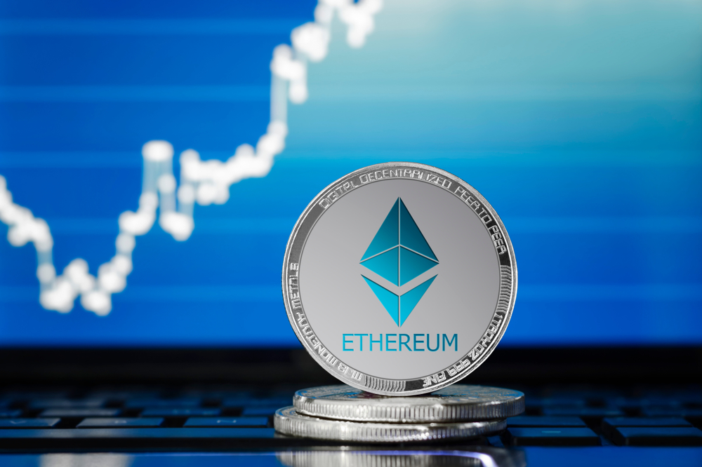 ETHEREUM (ETH) cryptocurrency; silver ethereum coin on the background of the chart - Image(AlekseyIvanov)s