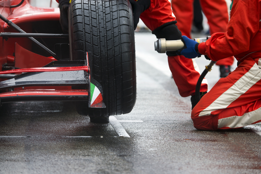 Professional racing team at work during a pitstop of a race car in the pitslane during a car race. - Image(Corepics VOF)s