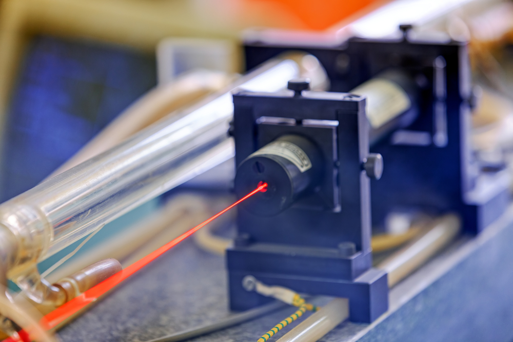 Red laser on optical table in physics laboratory - Image( Vladimir Nenezic)s