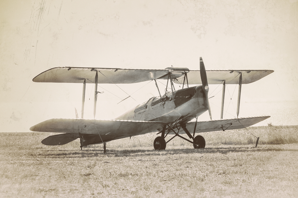 Old airplane at the airfield. Air travel with biplane - concept of retro aviation. Retro image of old aircraft.( Repina Valeriya)s