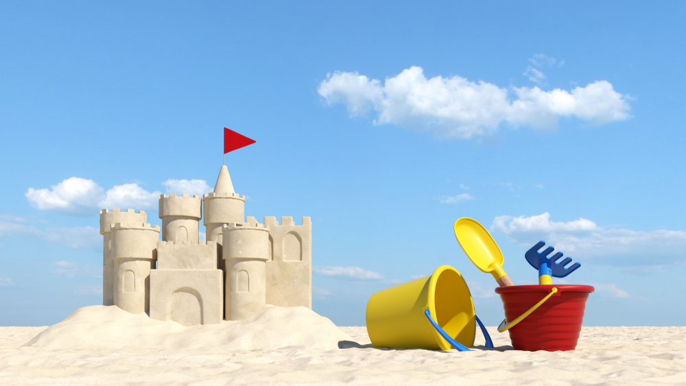 Summer vacation on the beach with sand castle and toys (3d rendering) - Illustration)( Robert Kneschke)s