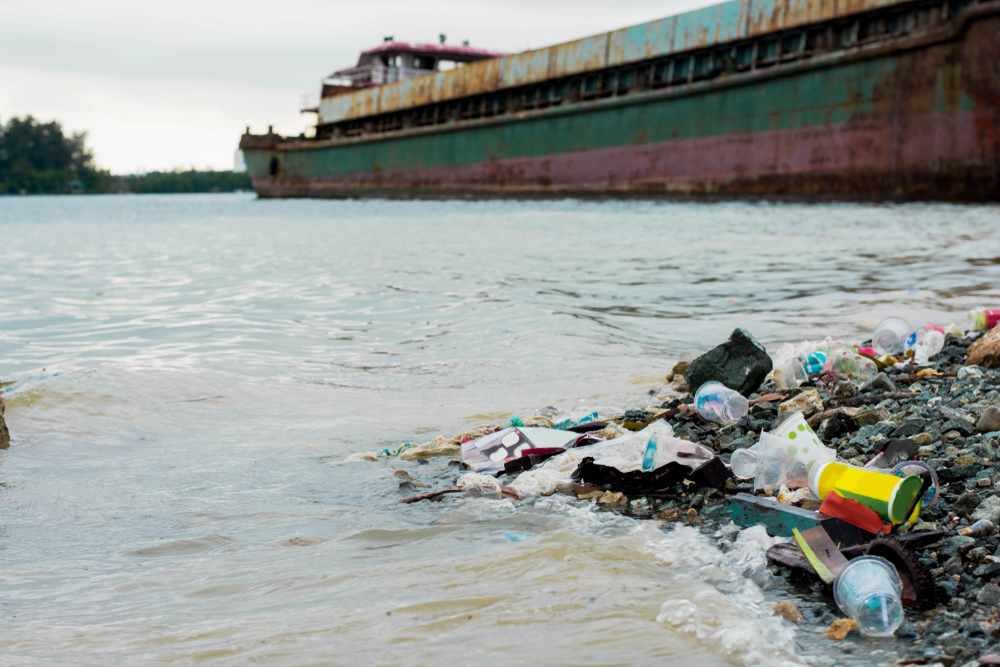 Garbage in the sea with abandoned ship wreck, Environmental problem concept(SVRSLYIMAGE)s