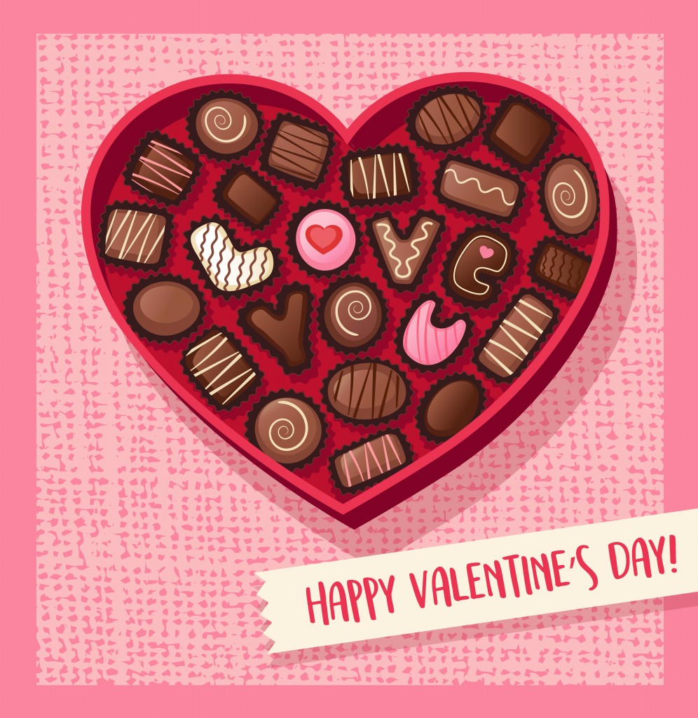 Heart shaped valentines day candy box with chocolate bonbons that spell Love You(TeddyandMia)s