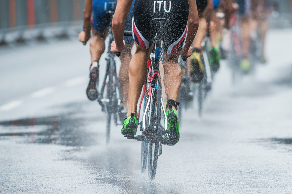 STOCKHOLM - AUG, 23 Triathletes cycling in the heavy rain with water spraying from the wheel( Stefan Holm)s