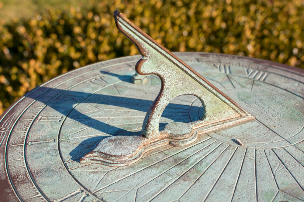 vintage sundial with green patina throws a long shadow, tracking the motion of the sun while telling the time of day( Jerry Regis)S