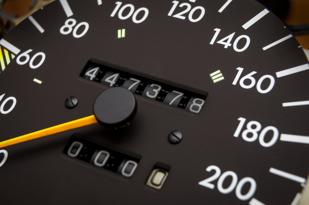 Close up shot of a speedometer in a car. Car dashboard odometer