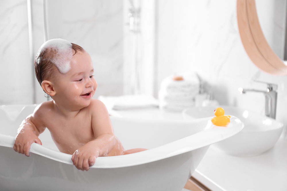 Cute little baby in bathtub at home(New Africa)s