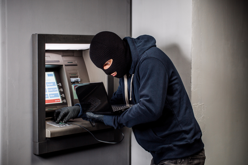 Hacker stealing password and identity on atm machine(PRESSLAB)s