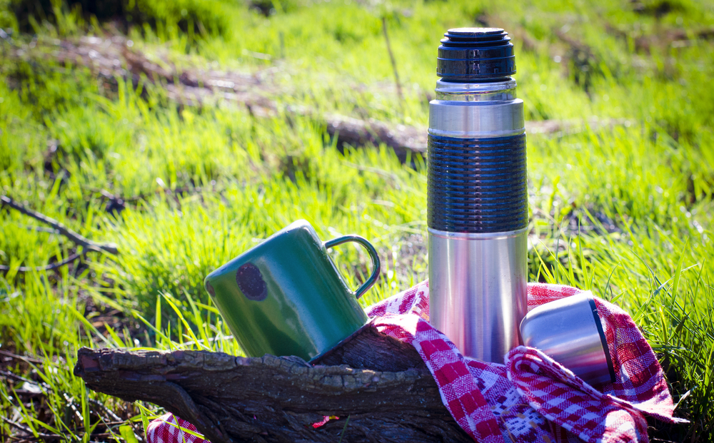 thermos and a cup used in nature(Katya123ua)s