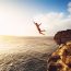 Cliff Jumping into the Ocean at Sunset(EpicStockMedia)S