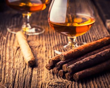 quality cigars and cognac on an old wooden table(Adrian_am13)s