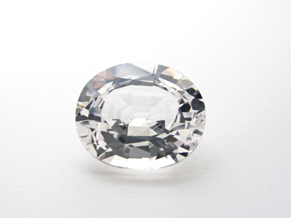 white sapphire oval cut gem isolated on white background for gem jewelry(photo33mm)s