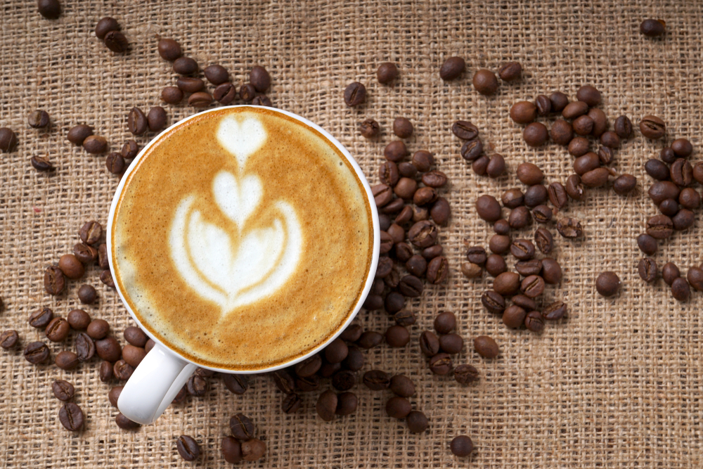 Cup of coffee latte art and coffee beans(PINANDIKA ANINDYA GUNA)s