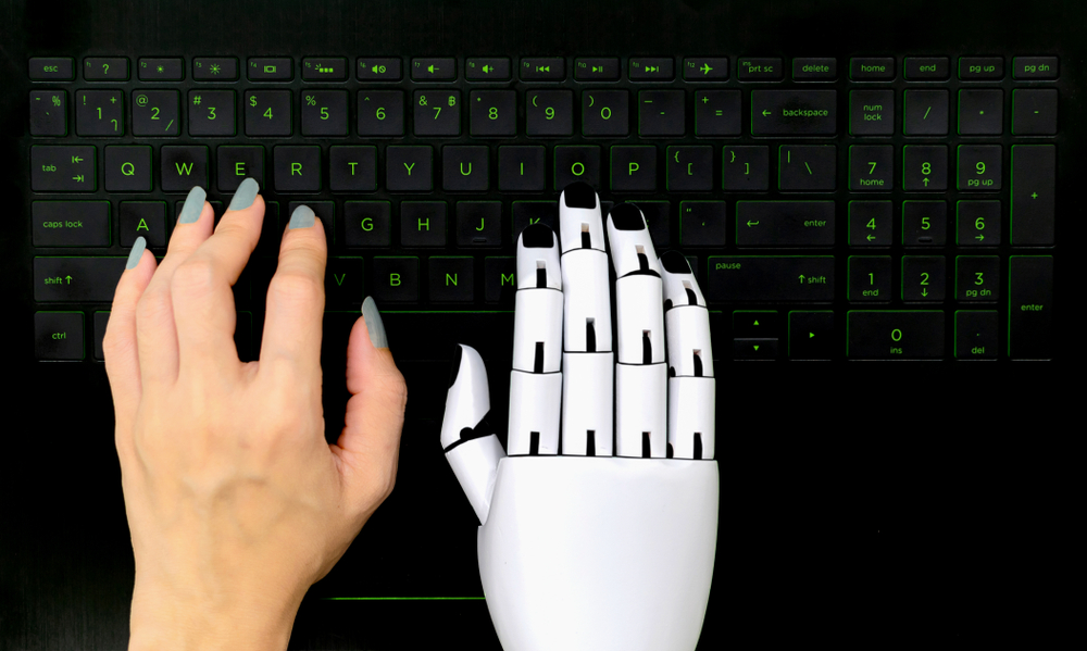 Robot concept chatbot of Human hand and robot hand pressing computer keyboard enter(kung_tom)s
