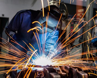 welder is welding metal part in car factory(Factory_Easy)s