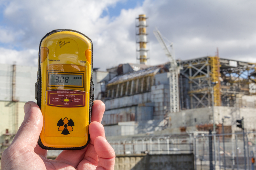 Dosimeter and Nuclear Power Plant on the background(Eight Photo)s