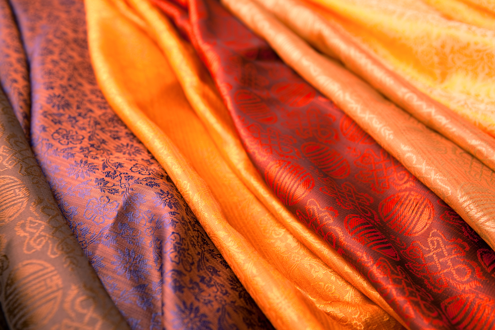 Silk scarves from India in a marketplace(Mara Fribus)s