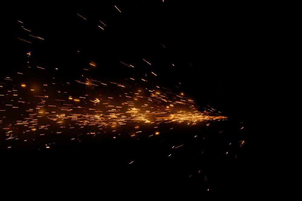 Fire sparks on a black background during metal cutting(Aynur_sib)S