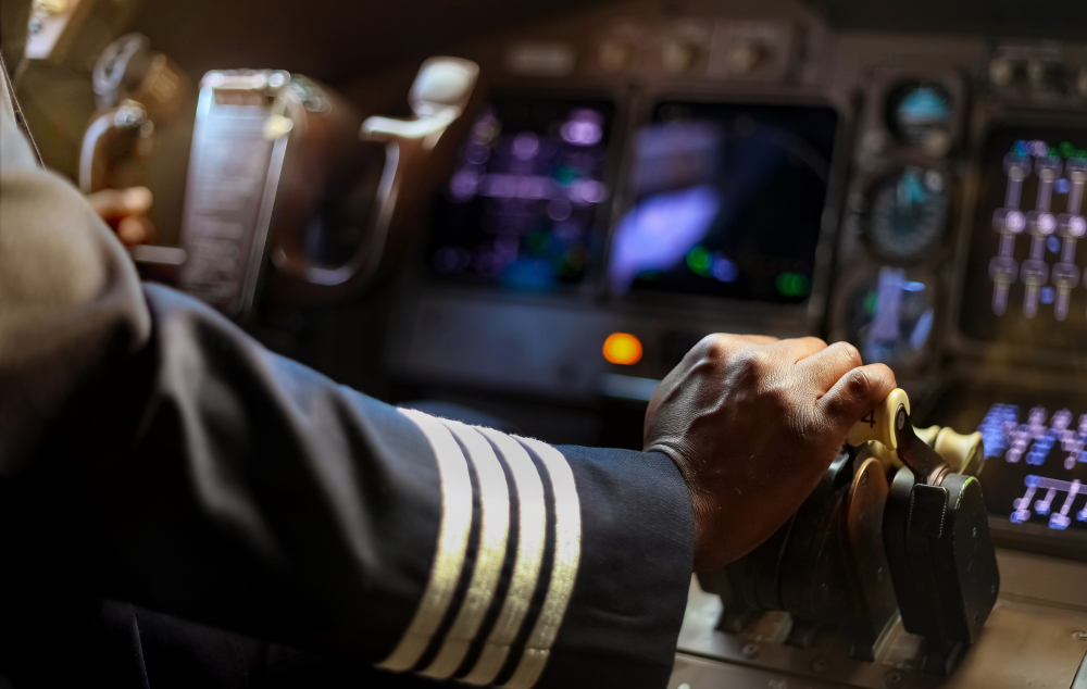 Cropped,Hands,Of,African,Pilot,Flying,A,Commercial,Airplane,,Cockpit