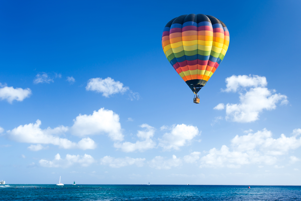 Colorful,Hot,Air,Balloon,Fly,Over,The,Blue,Sea