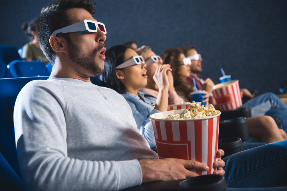 Shocked,Multiethnic,Friends,In,3d,Glasses,With,Popcorn,Watching,Film