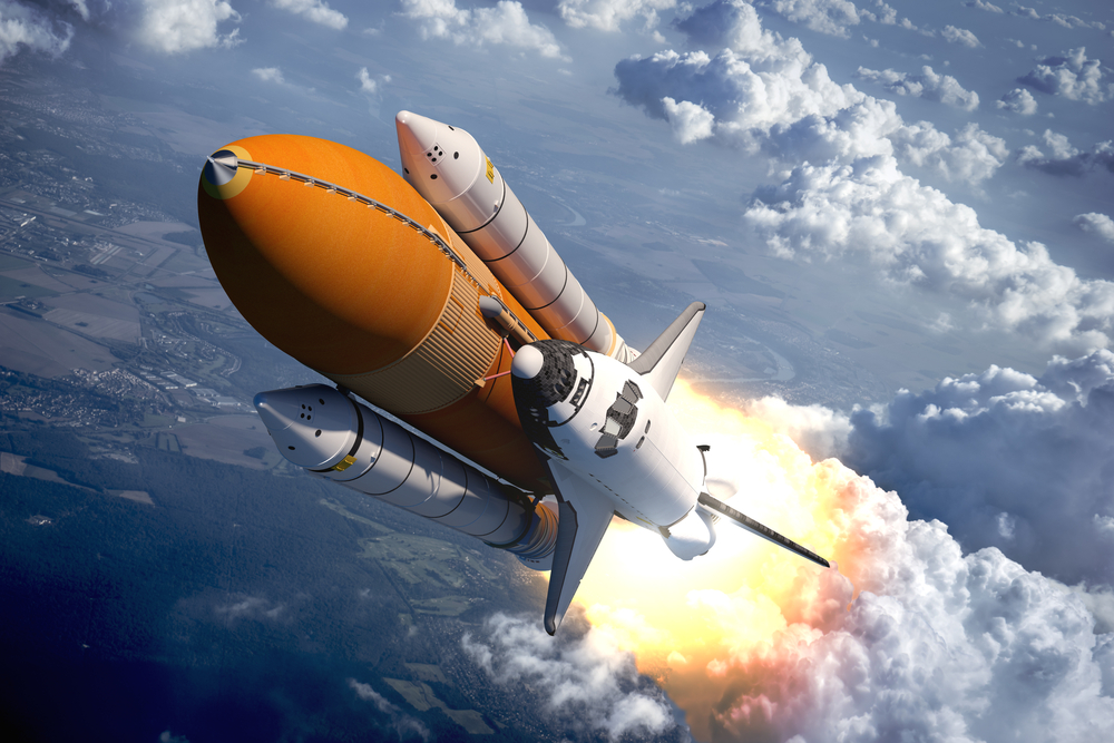 Space,Shuttle,Flying,Over,The,Clouds.,3d,Scene.