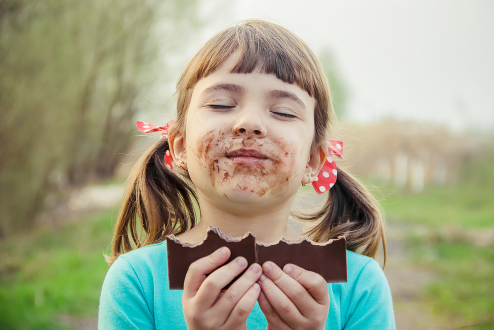 A,Sweet-toothed,Child,Eats,Chocolate.,Selective,Focus.