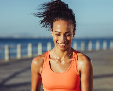 Smiling,Young,Female,Runner,Taking,A,Breather.,Healthy,Young,Woman